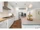 Spacious kitchen with island seating, stainless appliances and modern gas cooktop at 2658 Manor Stone Way, Indian Trail, NC 28079