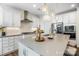 Well-appointed kitchen featuring large island, seating, and stainless appliances at 2658 Manor Stone Way, Indian Trail, NC 28079