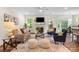 Bright living room with fireplace, ceiling fan, and easy access to dining area at 2658 Manor Stone Way, Indian Trail, NC 28079