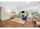 An open floor plan of the living spaces showcasing a living room with hard wood floors at 2658 Manor Stone Way, Indian Trail, NC 28079