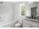 Bathroom featuring a soaking tub, tiled shower, and granite countertop at 27 Mickley Ave, Bessemer City, NC 28016
