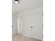 Bright bedroom features plush carpet, fresh white walls, two doors and a modern light fixture at 27 Mickley Ave, Bessemer City, NC 28016