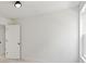 Bright bedroom features plush carpet, a large window providing natural light, and fresh white walls at 27 Mickley Ave, Bessemer City, NC 28016