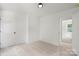 Bright bedroom features plush carpet, neutral walls and access to another room at 27 Mickley Ave, Bessemer City, NC 28016