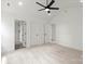 Bright bedroom with neutral carpet, ceiling fan, and ensuite bathroom at 27 Mickley Ave, Bessemer City, NC 28016