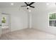 Bright bedroom with plush carpet, neutral walls, and a window providing natural light at 27 Mickley Ave, Bessemer City, NC 28016