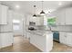 Contemporary kitchen featuring granite countertops, stainless steel appliances, white cabinets, and pendant lighting above the island at 27 Mickley Ave, Bessemer City, NC 28016