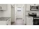 Modern kitchen featuring white cabinets, granite counters, and stainless steel appliances, providing modern amenities at 27 Mickley Ave, Bessemer City, NC 28016