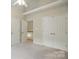 Bright bedroom featuring neutral walls, carpeted floors and a large closet at 2725 Cotton Planter Ln, Charlotte, NC 28270