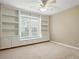 Bedroom featuring built-in shelving and window bench seating at 2725 Cotton Planter Ln, Charlotte, NC 28270