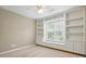 Bedroom featuring built-in shelving and window bench seating at 2725 Cotton Planter Ln, Charlotte, NC 28270