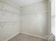 An open, walk-in closet with ample wire shelving perfect for organization and optimizing storage at 2725 Cotton Planter Ln, Charlotte, NC 28270