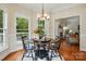 Breakfast nook featuring a round wood table set for four near access to exterior at 2725 Cotton Planter Ln, Charlotte, NC 28270