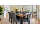 Dining area with wainscoting, light walls, and stylish chandelier above dark wood table at 2725 Cotton Planter Ln, Charlotte, NC 28270