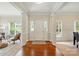 Spacious foyer with hardwood floors, decorative pillars, and ample natural light at 2725 Cotton Planter Ln, Charlotte, NC 28270