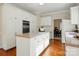 Bright kitchen featuring stainless steel appliances, granite countertops, and custom white cabinetry at 2725 Cotton Planter Ln, Charlotte, NC 28270