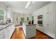 Bright kitchen featuring stainless steel appliances, granite countertops, and custom white cabinetry at 2725 Cotton Planter Ln, Charlotte, NC 28270