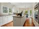 Kitchen featuring granite countertops, kitchen island, and windows bringing the outside in at 2725 Cotton Planter Ln, Charlotte, NC 28270