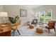 Sitting area with light walls, neutral colors, and accent furniture at 2725 Cotton Planter Ln, Charlotte, NC 28270