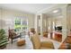 Bright living room with hardwood floors, neutral walls, accent chairs, large windows, and open floor plan at 2725 Cotton Planter Ln, Charlotte, NC 28270