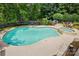 Backyard pool with adjacent spa tub and dining space at 2725 Cotton Planter Ln, Charlotte, NC 28270