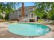 Backyard pool with lounge chairs and adjacent hot tub at 2725 Cotton Planter Ln, Charlotte, NC 28270