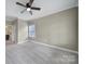 Bedroom with neutral walls, carpeted floors, a ceiling fan, and an ensuite bathroom at 295 Helton Ln, Fort Mill, SC 29708