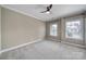 Bedroom featuring neutral walls, carpeted floors, a ceiling fan, and natural light from the windows at 295 Helton Ln, Fort Mill, SC 29708