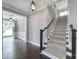 Entryway with dark hardwood floors, staircase, modern lighting, and open access to other rooms at 295 Helton Ln, Fort Mill, SC 29708