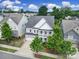 Beautiful home exterior with a well-manicured front yard, a covered front porch, and a two-car garage at 295 Helton Ln, Fort Mill, SC 29708