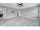 Spacious main bedroom featuring neutral walls, carpeted floor, and an ensuite bathroom at 295 Helton Ln, Fort Mill, SC 29708