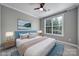 Bedroom with a large window, neutral walls, a ceiling fan, and a framed picture above the headboard at 295 Helton Ln, Fort Mill, SC 29708