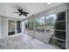 Bright sunroom features light wood floors and large windows overlooking an outdoor patio with seating at 295 Helton Ln, Fort Mill, SC 29708