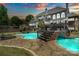 Luxurious backyard with a large pool, stone pathways, and lush landscaping, perfect for outdoor relaxation at 2971 Kaneland Ct, Rock Hill, SC 29732
