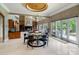 Elegant dining area with a glass table, stylish chairs, and access to the outdoor patio at 2971 Kaneland Ct, Rock Hill, SC 29732