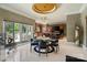 Bright dining area features a glass table, stylish chairs, and access to the outdoor patio at 2971 Kaneland Ct, Rock Hill, SC 29732