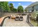 Outdoor gathering area with a custom stone fire pit and ample seating for entertaining at 2971 Kaneland Ct, Rock Hill, SC 29732