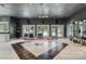 Grand foyer with decorative tile flooring, glass display cabinets, and access to the outdoor pool area at 2971 Kaneland Ct, Rock Hill, SC 29732