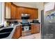 Well-equipped kitchen features stainless steel appliances and cherry wood cabinetry at 2971 Kaneland Ct, Rock Hill, SC 29732