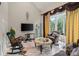 Cozy living area with comfortable seating, a large window, and a flat-screen TV at 2971 Kaneland Ct, Rock Hill, SC 29732
