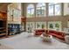 Spacious living room with fireplace, large windows, and comfortable seating area at 2971 Kaneland Ct, Rock Hill, SC 29732