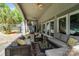 Relax on this covered patio with comfortable seating, offering a great view of the backyard and pool at 2971 Kaneland Ct, Rock Hill, SC 29732