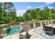 Enjoy outdoor living on this patio with a lovely view of the pool and backyard landscaping at 2971 Kaneland Ct, Rock Hill, SC 29732