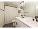Bathroom featuring double sinks, quartz countertops and matte black fixtures and shower at 3020 Quiet Ln, Iron Station, NC 28080