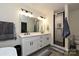 Bathroom featuring a double vanity, walk-in shower, and modern finishes for a luxurious feel at 3020 Quiet Ln, Iron Station, NC 28080