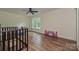 room with hardwood floors, natural lighting and a small table and chair set at 3020 Quiet Ln, Iron Station, NC 28080