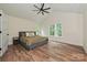 Spacious bedroom with vaulted ceilings, hardwood floors, and ample natural light at 3020 Quiet Ln, Iron Station, NC 28080