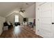 Spacious bonus room with hardwood floors, a ceiling fan, furniture and natural lighting at 3020 Quiet Ln, Iron Station, NC 28080