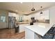 This kitchen features white cabinets, modern appliances, and a spacious island with a butcher block countertop at 3020 Quiet Ln, Iron Station, NC 28080