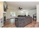 Cozy living room featuring hardwood floors, a fireplace, and a comfortable sectional couch at 3020 Quiet Ln, Iron Station, NC 28080